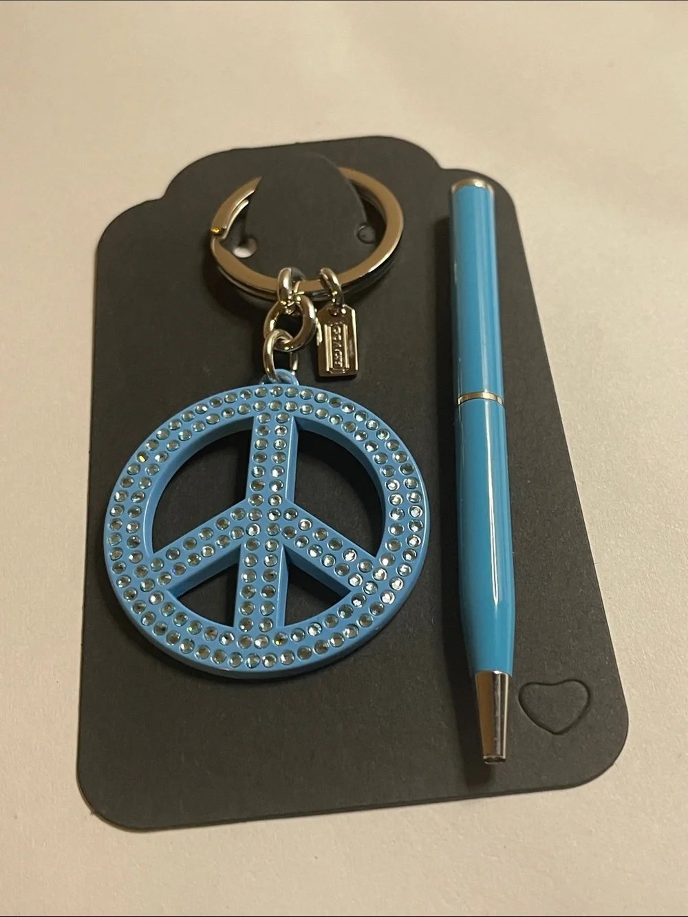 Coach Light Blue Crystal Peace Sign Keyring and Coach Pen